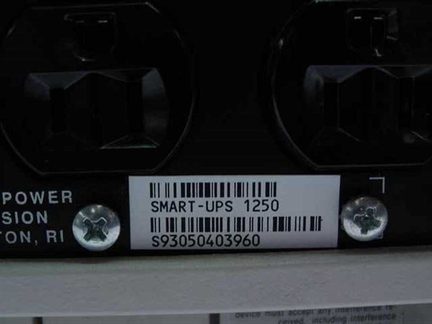 APC Smart-UPS 1250 label closeup showing model SMART-UPS 1250 and serial number barcode