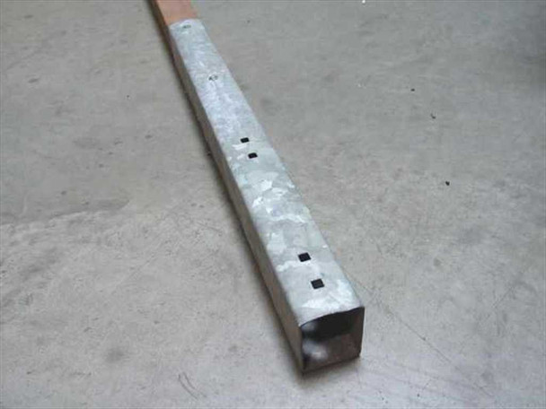 NM 85 military tent ridge section — galvanized square steel channel end showing mounting holes, wood core visible