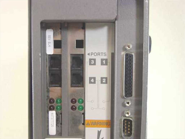AT&T Merlin Mail MM04 — port panel close-up showing 4 analog phone ports (labeled 1–4), status LEDs, DB25 parallel connector, and DB9 serial connector