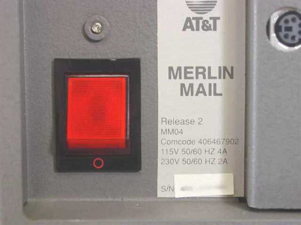 AT&T Merlin Mail MM04 — rear label close-up showing Release 2, model MM04, Comcode 406467902, 115V/230V 50/60Hz power ratings, and power rocker switch