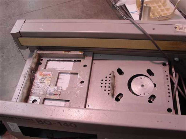 Horizon BQ-140 Perfect Binder – top cover removed showing internal mechanism with adhesive residue and glue pot area