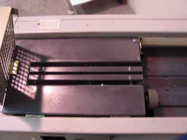 Horizon BQ-140 Perfect Binder – interior view of clamp/nipper assembly showing three-roller book transport mechanism