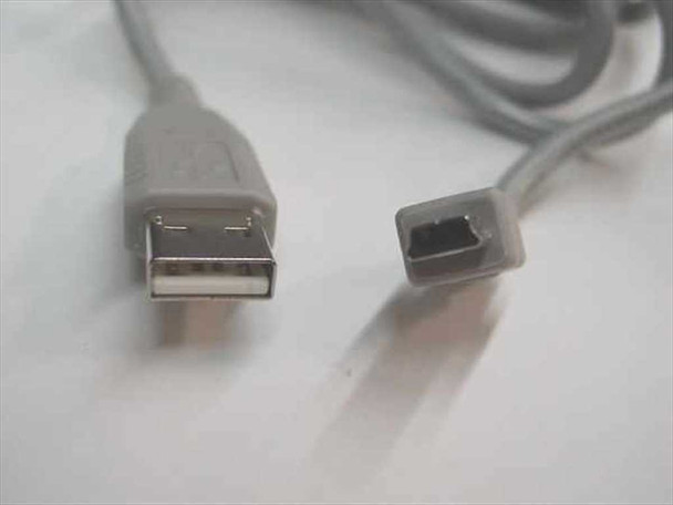 Close-up of USB Type A male and 5-pin Mini USB B male connector ends showing molded gray strain relief