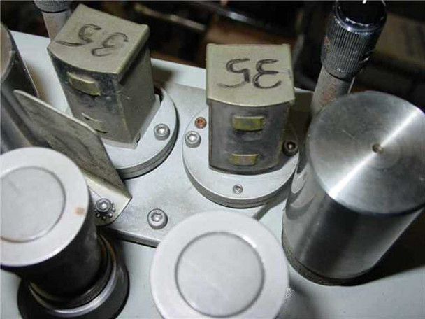 Magna Tech MR-436-3 film transport head assembly close-up showing two magnetic heads labeled '35' with mounting hardware and capstan rollers