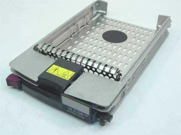 Compaq 143920-001 18GB Ultra2 SCSI hot-plug hard drive caddy – front/top view showing drive seated in carrier tray with purple latch handle