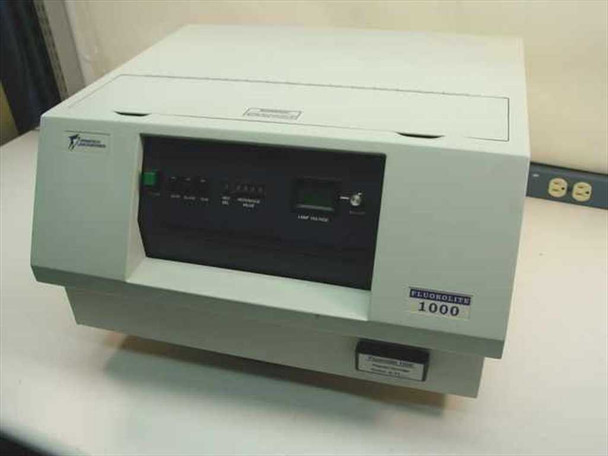 Dynatech Laboratories Fluorolite 1000 Microplate Fluorometer – front view showing control panel, FLUOROLITE 1000 nameplate, and program cartridge slot