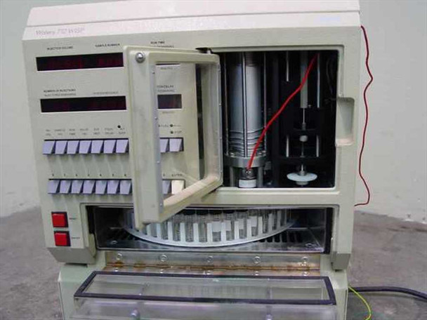 Waters 712 WISP – front view with access door open showing syringe drive mechanism, sample carousel, and internal injection assembly