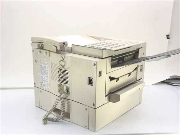 Canon H12013 LaserClass 7000 fax machine — rear left view showing power inlet, phone cord, and ventilation panel