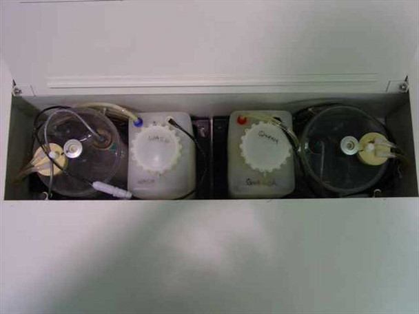 Hybritech Photon ERA-QA – internal reagent/fluid container compartment showing four labeled fluid containers with tubing