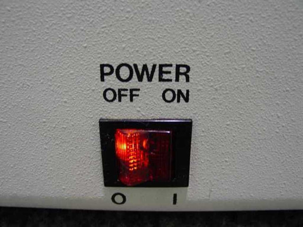 Hybritech Photon ERA-QA Analyzer – close-up of rear power switch labeled POWER OFF/ON with illuminated red rocker switch