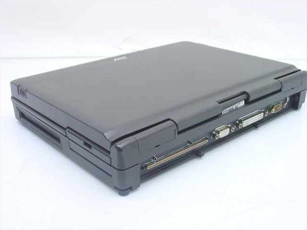 AST Ascentia 900N laptop closed — right-rear three-quarter view showing rear port area with VGA, parallel, serial, and PS/2 mouse connectors