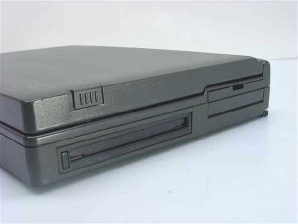 AST Ascentia 900N laptop closed — left side view showing 3.5-inch floppy drive bay and hard drive bay