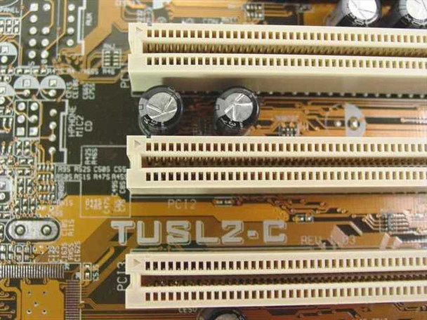 ASUS TUSL2-C motherboard – close-up of PCI slots showing PCB silkscreen model name TUSL2-C and revision marking