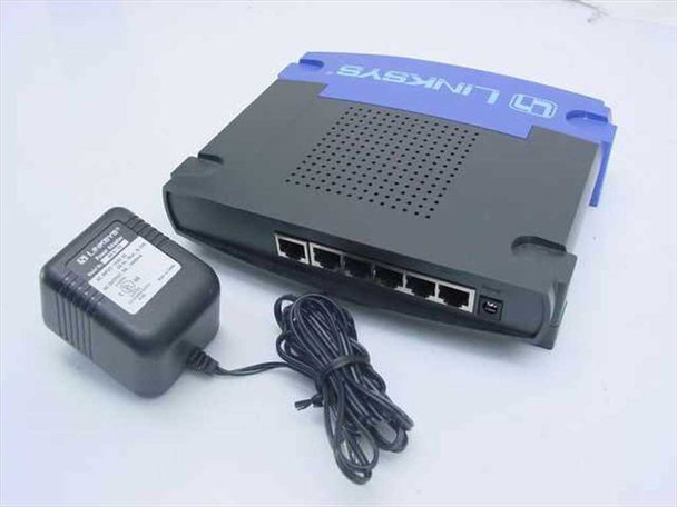 Linksys BEFSR41 router – rear panel showing 4 LAN ports, WAN port, uplink, and power jack with included AC adapter