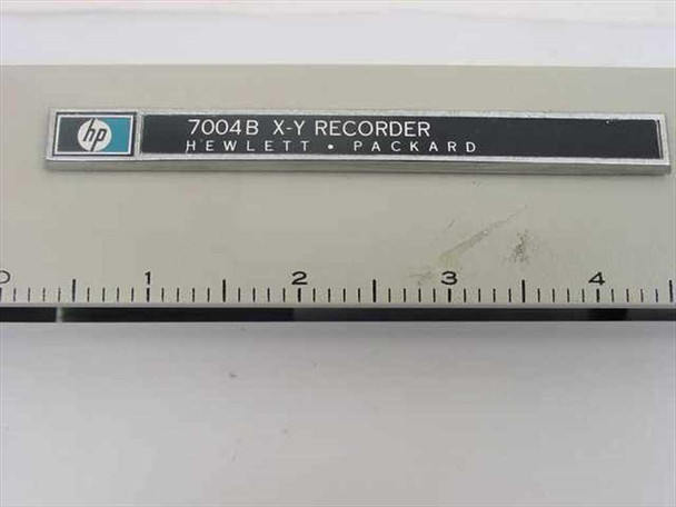 HP 7004B X-Y Recorder nameplate close-up reading '7004B X-Y RECORDER HEWLETT PACKARD' with HP logo and ruler scale