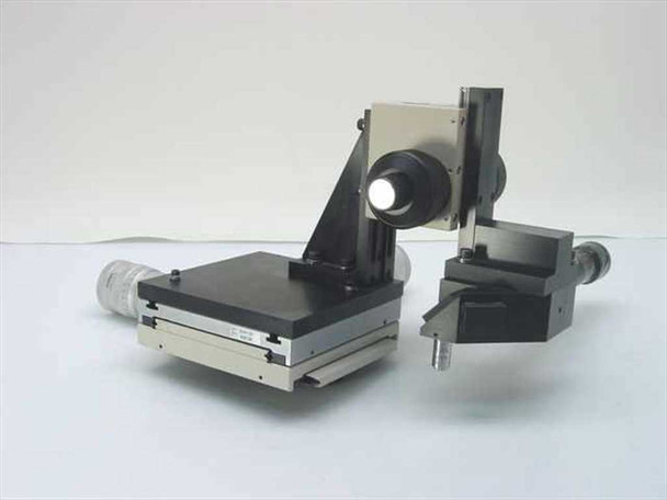 McBain XY microscope stage assembly — alternate three-quarter view showing Olympus BHMJ stage body with nameplate, XY stage platform, and Mitutoyo micrometer heads extending left and right