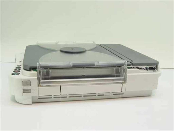 Canon PC150 personal copier – side view showing fold-up hinge mechanism, paper tray, and right-side panel
