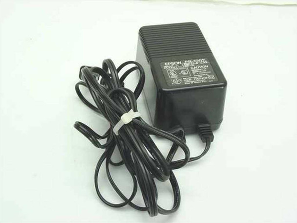 Epson PB-6509 AC adapter full view showing black housing and coiled power cord with 4-pin Mini-DIN output connector