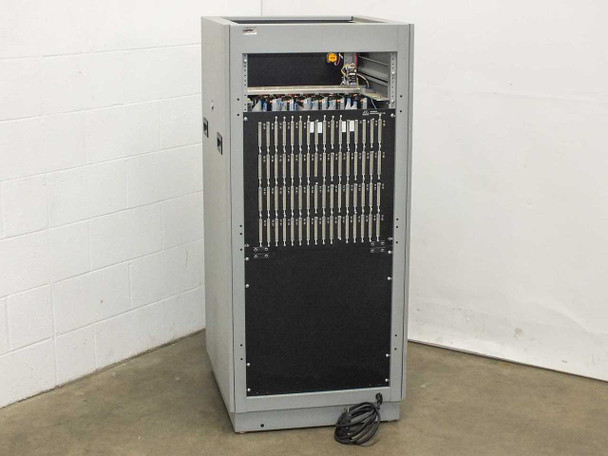 Advanced Microtechnology burn-in rack side view showing card cage slots, multiple plug-in card ejector handles, and power cable
