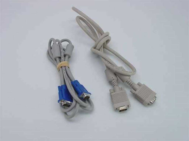 Two male-to-male 15-pin VGA SVGA monitor cables side by side — left cable has blue connector housings and is coiled with a rubber band, right cable is beige with beige connectors