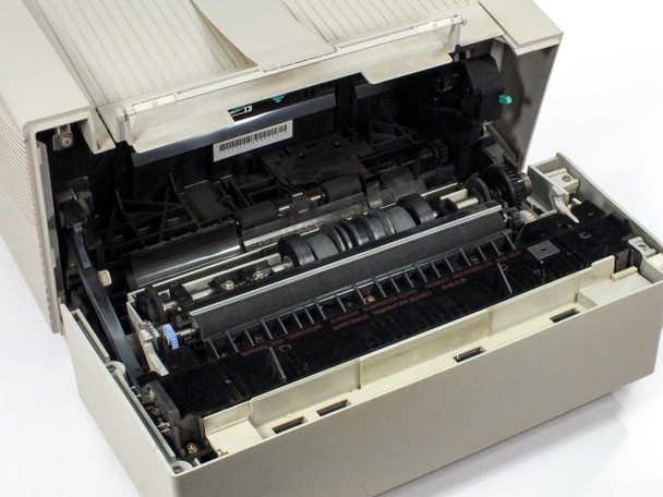 Apple Personal LaserWriter LS M2000 — top cover open showing internal laser print mechanism, rollers, and fuser assembly