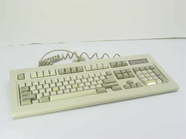 Mitsumi KPQ-E99YC full-size AT keyboard top view showing beige keys with yellowing and coiled cable