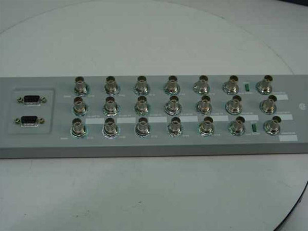 Nortel NTFP99AB DS3/E3 3-Channel Sparing Panel – rear view showing full array of BNC connectors in two rows, two DB9 ports on left side, and two green LED indicators
