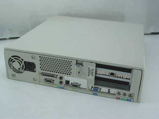 Dell OptiPlex GX1 rear panel showing parallel port, VGA, PS/2, USB, serial connectors and expansion slot covers