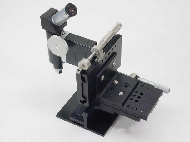 UltraTech 06-15-02711 tool maker's microscope assembly — front-left view showing 4x eyepiece head, Newport X-Y micrometer stage, and black anodized aluminum construction