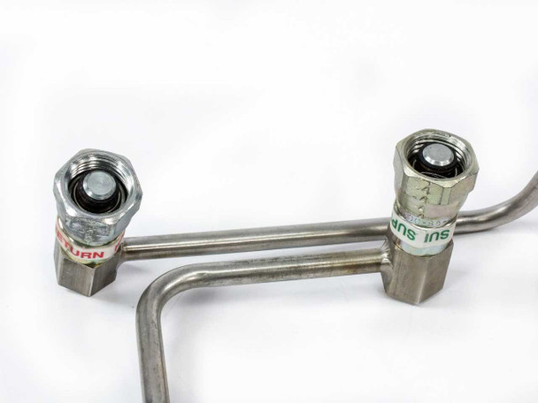 CTI Cryogenics 8143143 supply and return line pair – close-up of supply (SUP) and return (RETURN) labeled Aeroquip couplings showing O-ring seals and hex nut construction