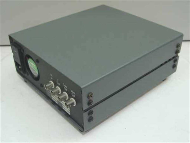 RMC Cryosystems CB-200 Current Buffer — left-rear three-quarter view showing BNC output connectors, circular meter indicator, and side panel LEDs