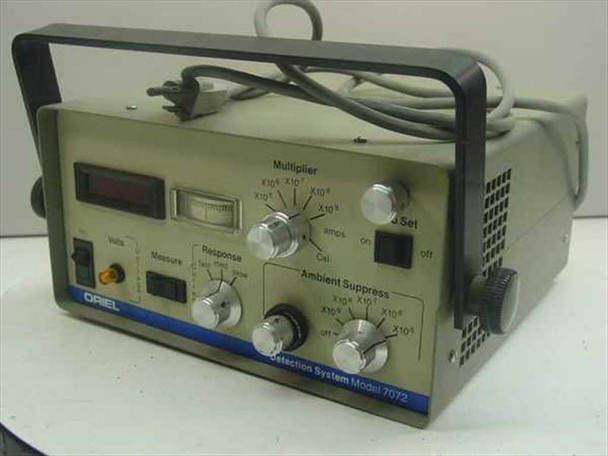 Oriel 7072 Photodiode Detection System Controller — front-left three-quarter view showing LED display, analog meter, Multiplier and Ambient Suppress knobs, and Oriel branding