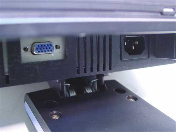 Samsung SyncMaster 152N rear panel showing VGA (HD-15) video input port and IEC C14 AC power inlet, with cable management clips on stand neck