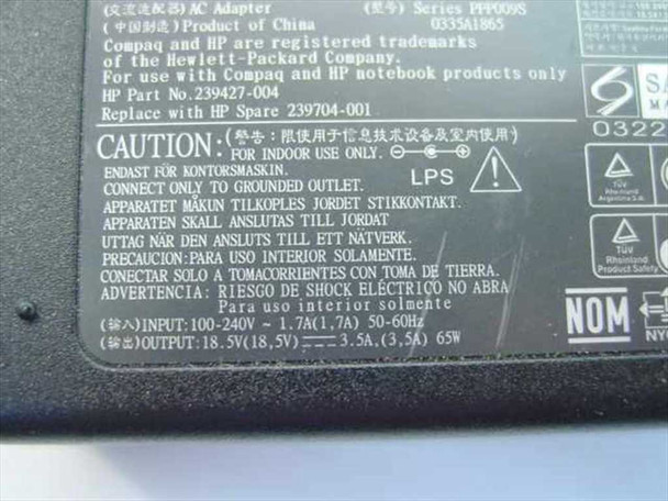 HP 239704-001 rating plate showing input 100-240V 1.7A, output 18.5V 3.5A 65W, series PPP009S