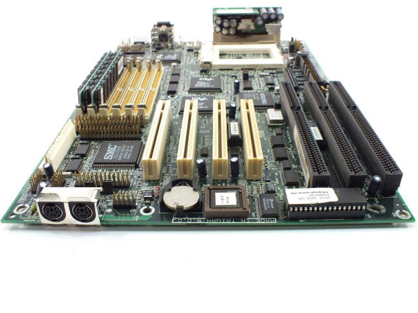 Acer 48.59101 Socket 8 motherboard rear-angle view showing VRM module installed in header, PS/2 ports, and ISA/PCI slot area