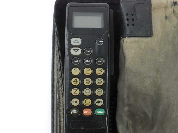 Motorola SCN2449A handset close-up showing LCD display, numeric keypad, and function buttons including pwr, snd, and rcl