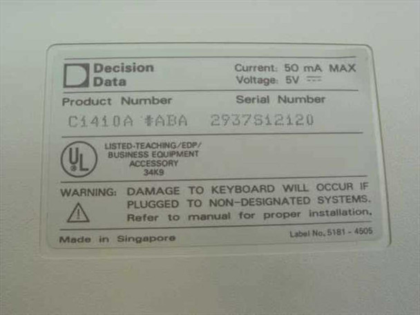 Decision Data C1410A bottom label showing product number, serial number, 5V 50mA rating, UL listing, and Made in Singapore