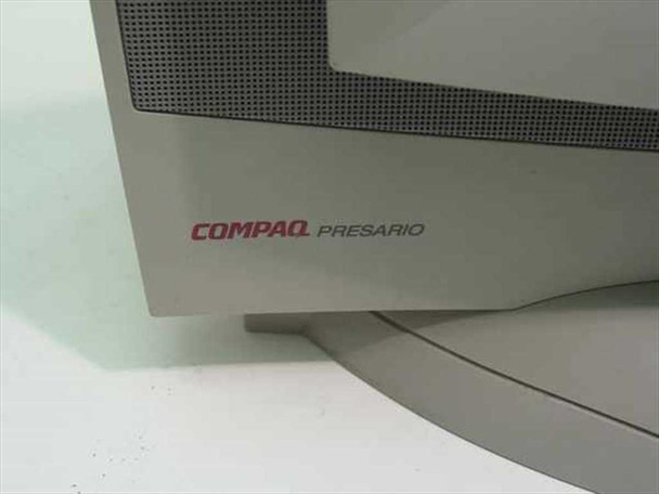 Compaq Presario branding close-up showing red COMPAQ PRESARIO logo on lower-left panel