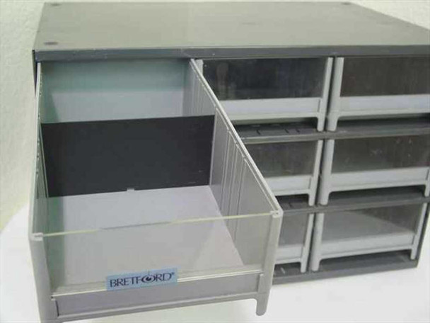 Bretford parts cabinet with one drawer pulled fully open revealing interior depth and Bretford logo label on drawer front
