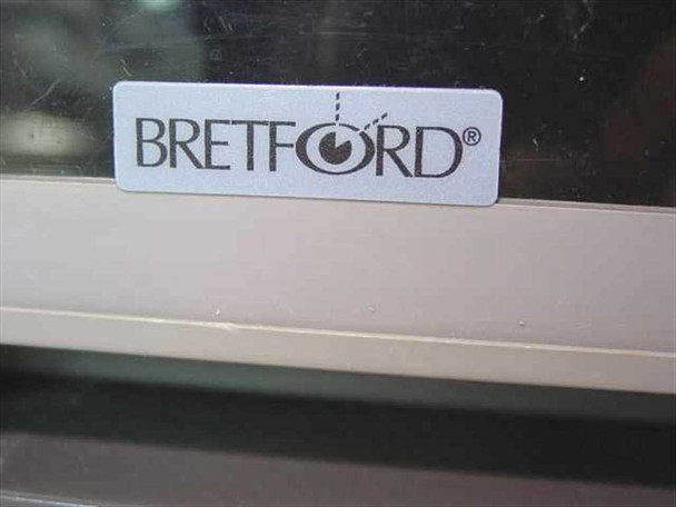Close-up of Bretford logo label on cabinet drawer front
