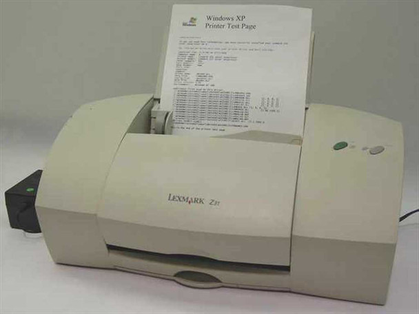 Lexmark Z31 inkjet printer front view with Windows XP test page loaded in paper tray