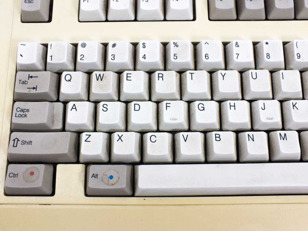 DEC RT101+ keyboard keycap close-up showing light soiling on key tops and colored indicator dots on Alt and Ctrl keys