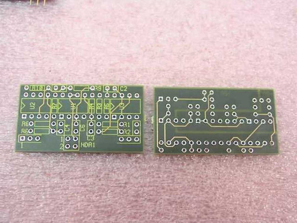 Top and bottom views of two unpopulated daughter PCBs showing through-hole component footprints and HDR1 header pads