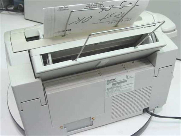 Brother IntelliFAX 2600 rear and top view with document feeder lid open, showing paper path, ventilation, and power cord