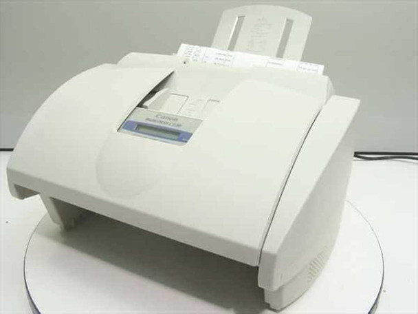 Canon MultiPass C530 all-in-one inkjet printer fax copier scanner — front three-quarter view showing overall unit in white housing with paper tray raised