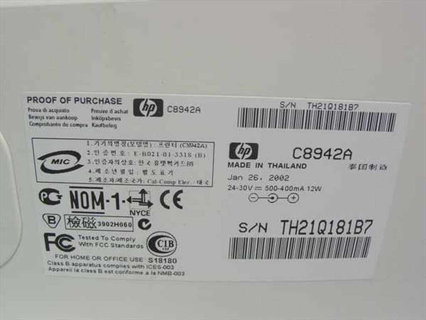 HP DeskJet 656c C8942A rating plate close-up showing model number, manufacture date Jan 2002, voltage specs, and certifications