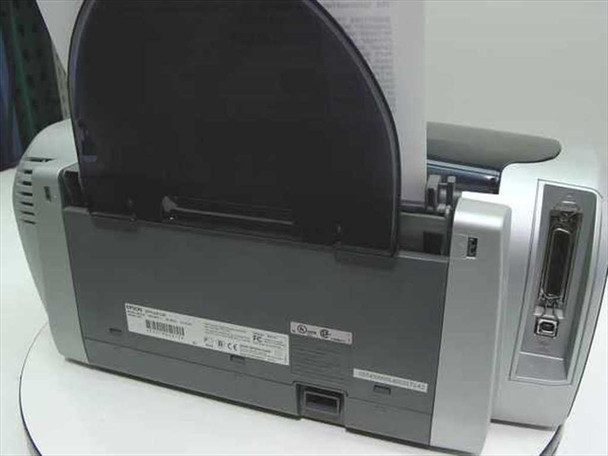 Epson Stylus C86 rear view showing paper feed tray, rating label, IEEE 1284 parallel port, and USB Type-B port
