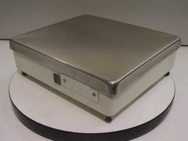 Toledo 8213 platform scale — front-left angled view showing stainless top and white body with side panel switch