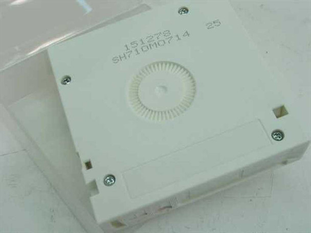 Bottom of Quantum DLTtape III XT cartridge showing reel hub and stamped serial number markings
