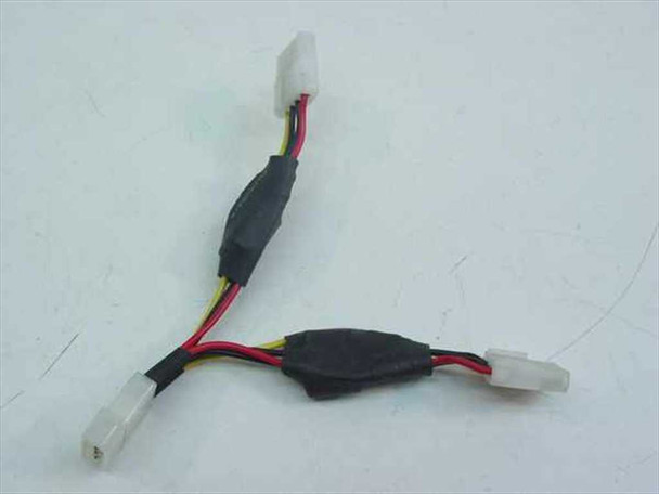 4-pin Molex power splitter Y cable showing 1 female input end and 2 male output connectors with black ferrite chokes on wires
